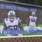 Cowboys lineman Booker back in New Haven for football camp