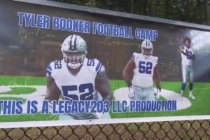Cowboys lineman Booker back in New Haven for football camp