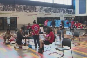 Children receive 600 free Nike, HOKA sneakers at Hartford Fleet Feet donation event