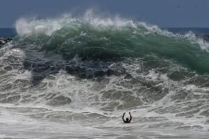 Historic swells continue to batter California beaches. When will the surf die down?
