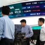 Asian shares are mixed and US futures fall as Iran talks make progress