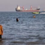 An oil tanker navigates the Strait of Hormuz despite threats from Iran's Revolutionary Guard