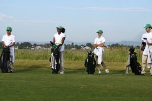 On an Aurora golf course, young caddies learn confidence, communication — and how to handle a paycheck