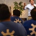 Day laborers come together at a convention to process a year and a half of ICE raids