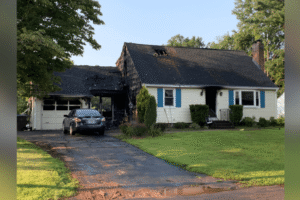 Dog dead, 2 people injured after New Britain house fire